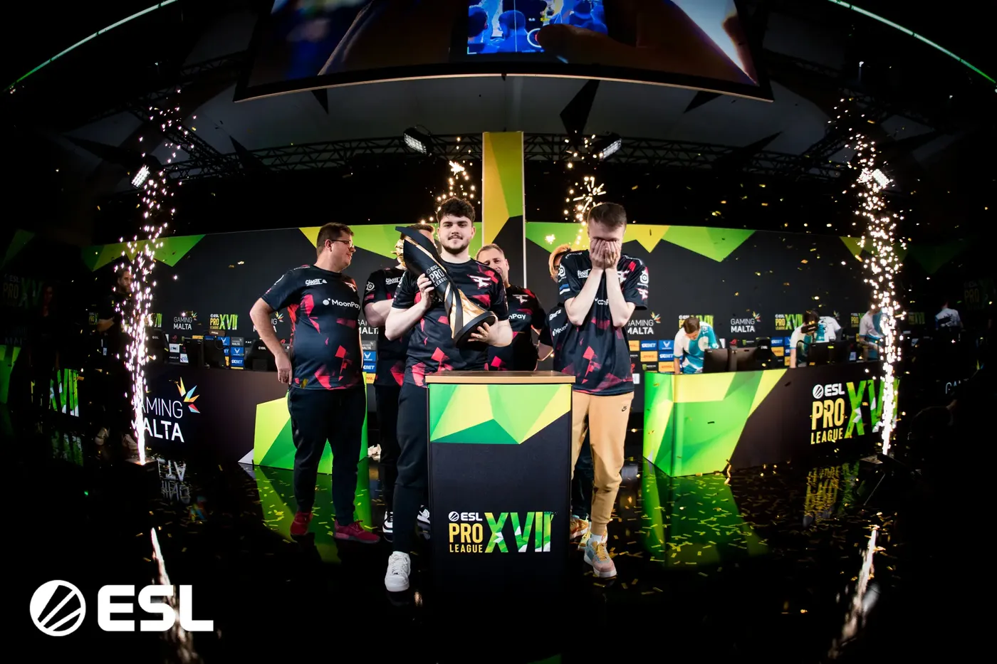 Team lifting the ESL Pro League trophy on stage