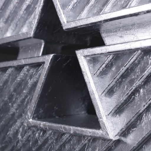 Brushed metal triangular forms on a custom trophy