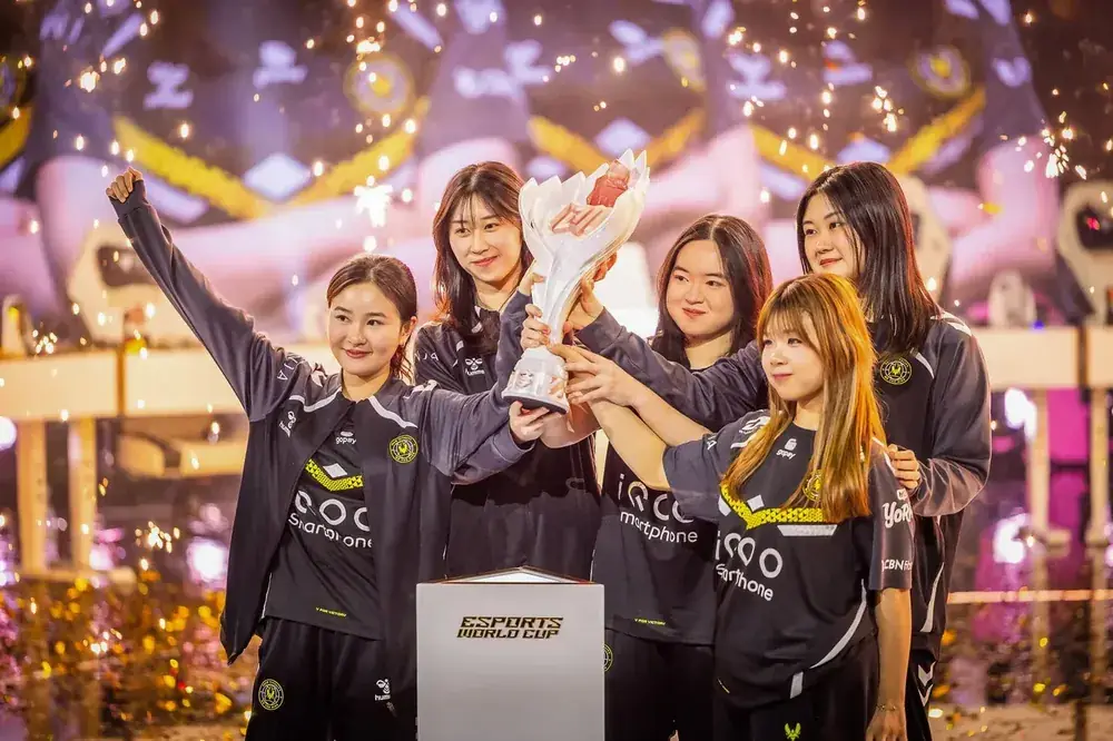 MLBB Women's Invitational winners with their trophy