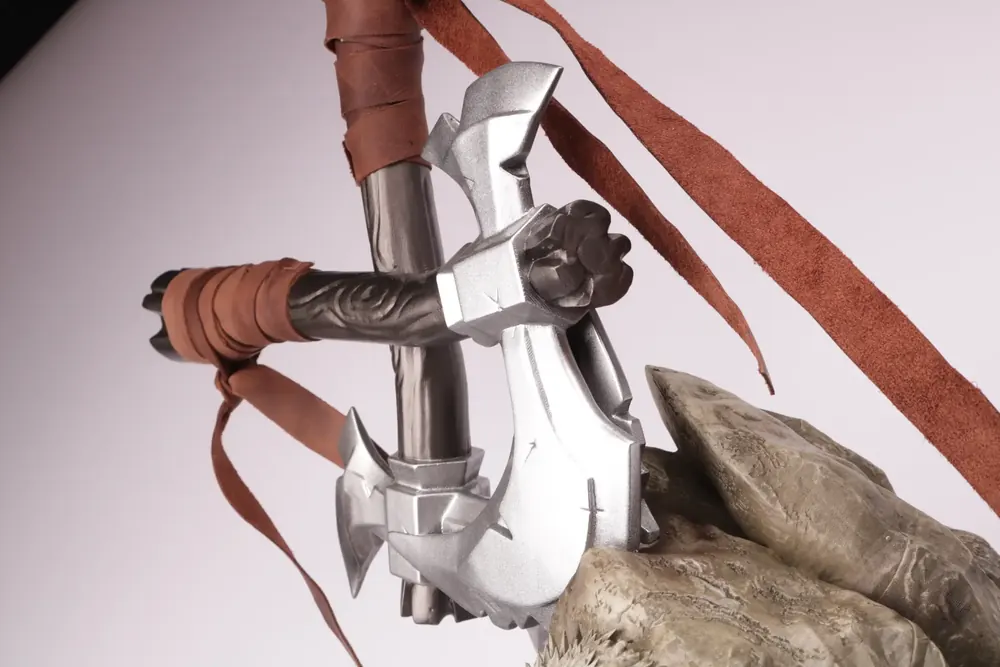 A forged metal weapon trophy wrapped by hand
