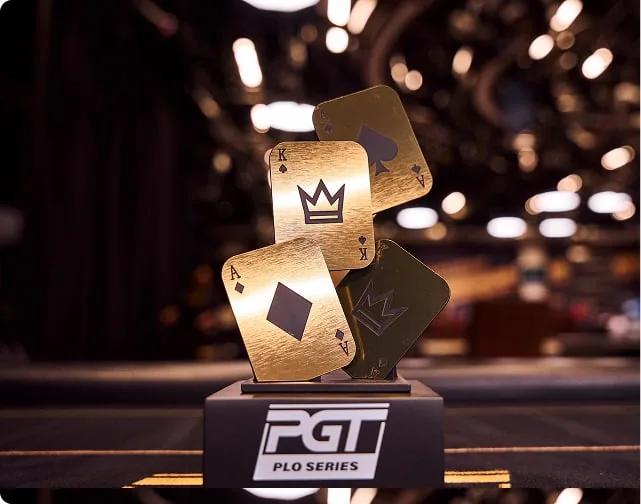 The PGT PLO Series trophy, brushed gold playing cards on a black base