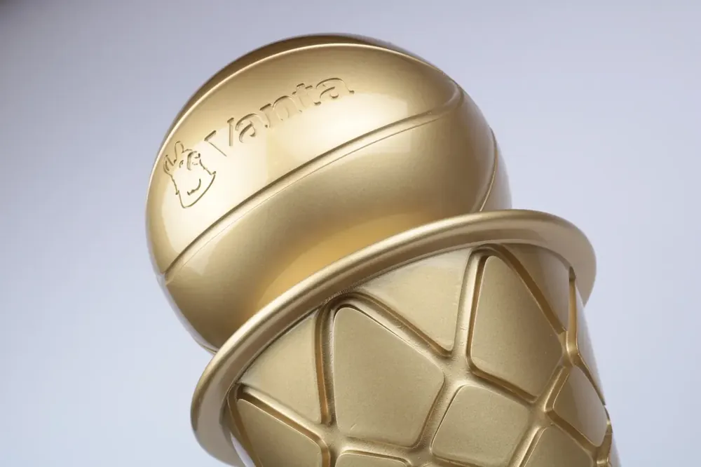 Gold geometric detail of the Vanta trophy